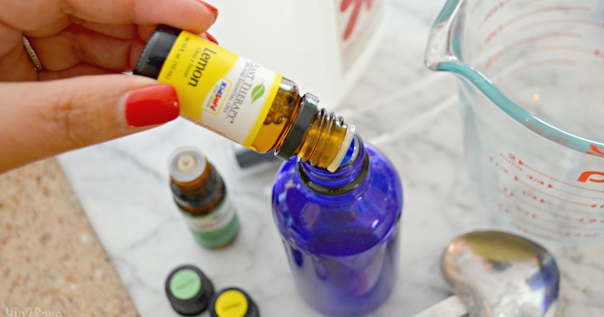 adding lemon oil to a spray bottle
