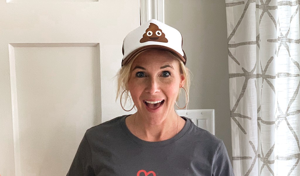 collin wearing poop emoji hat