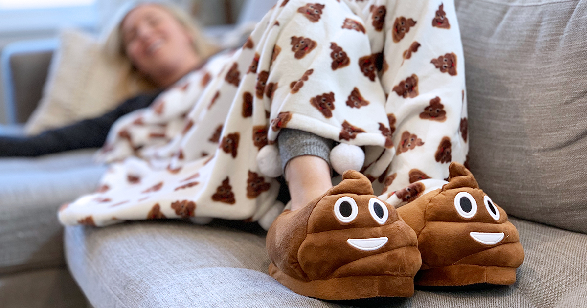 collin wearing poop slippers and blanket