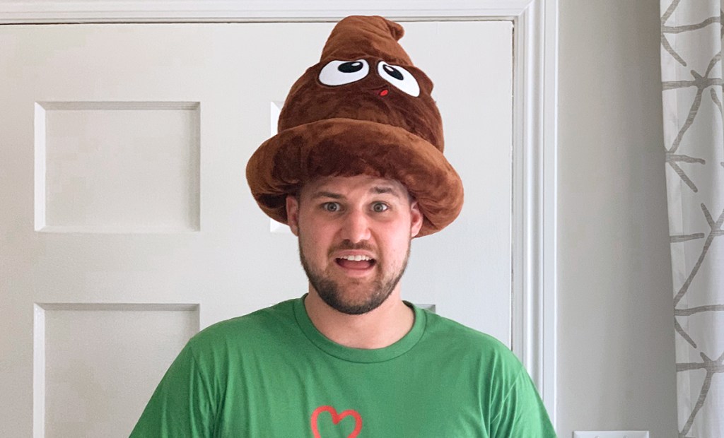 stetson wearing plush poop emoji hat